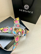 Versace belt buckle close-up with multicolor print and Versace branding on the strap