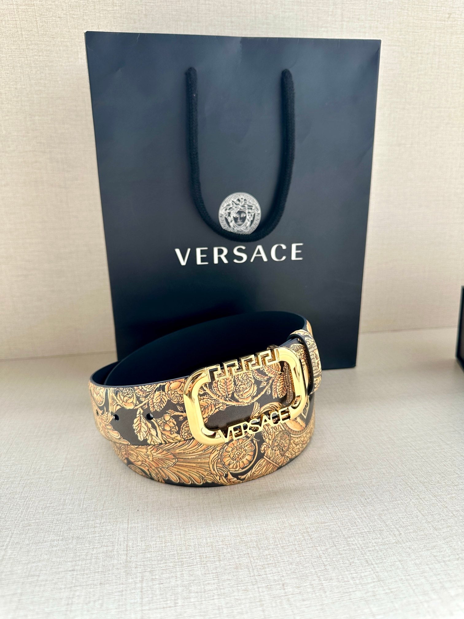 Versace belt bracelet-style coil with gold baroque print and gold buckle