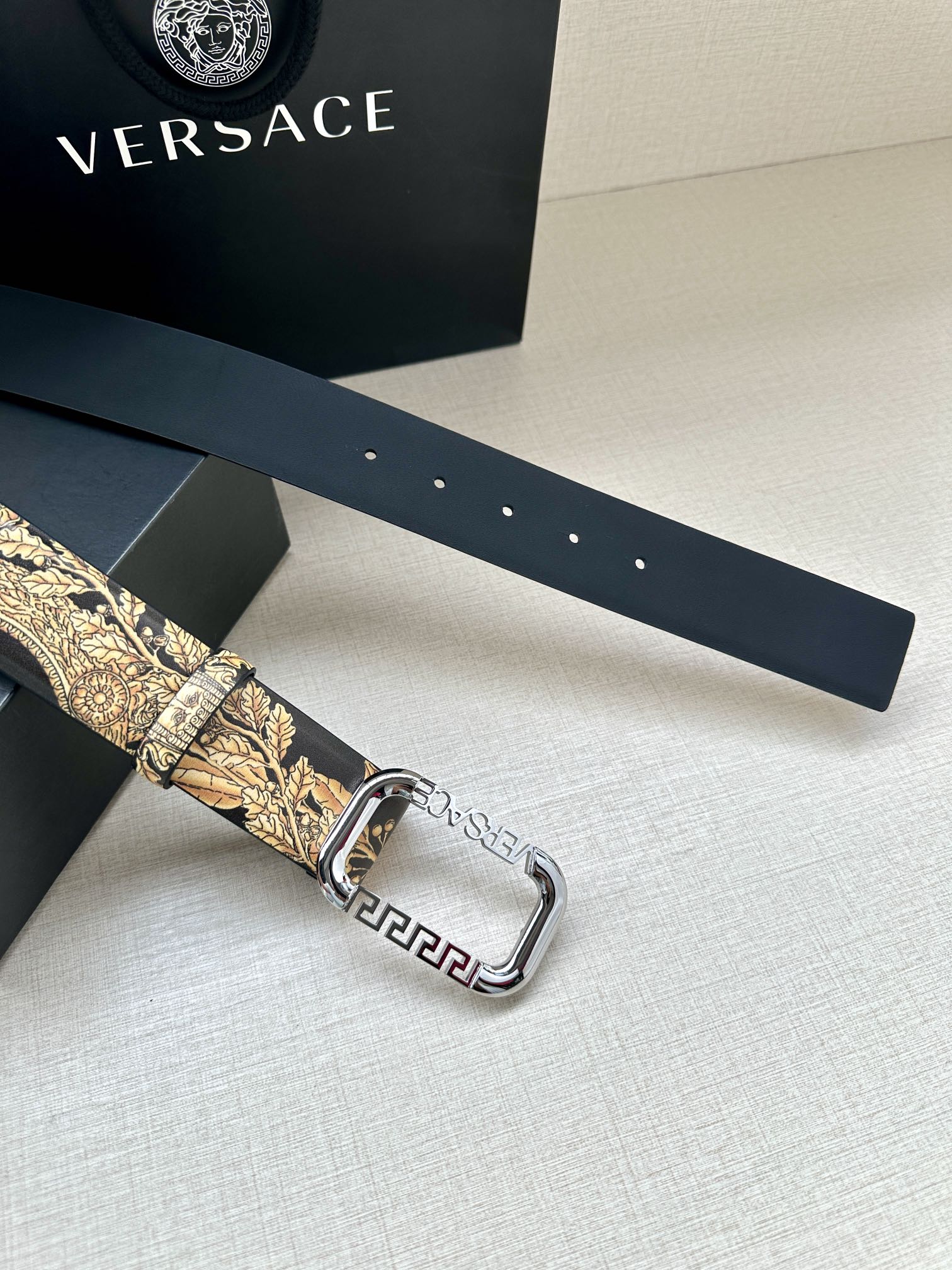 Versace belt on dark band with gold baroque strap and silver buckle