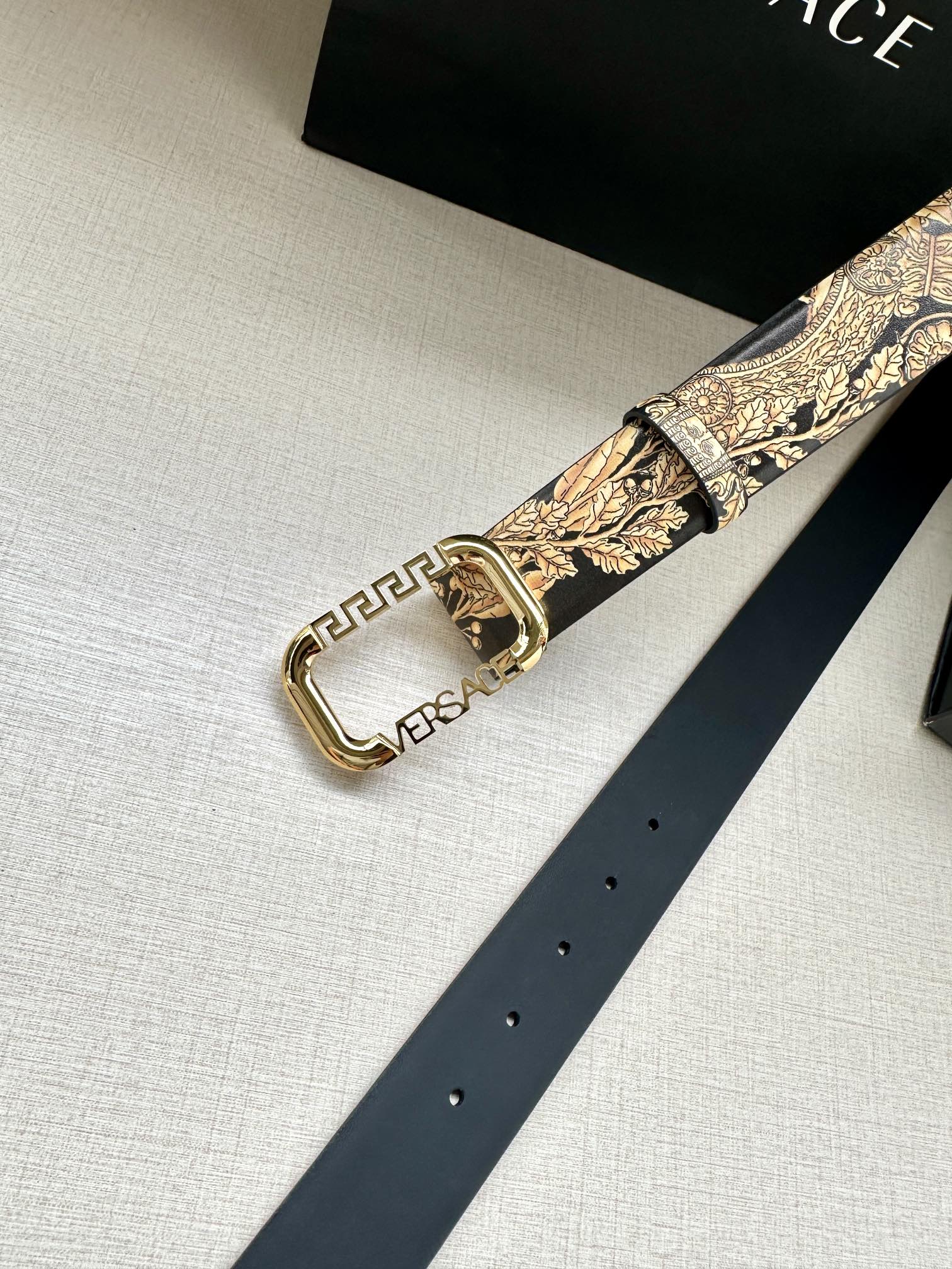 Versace belt with gold baroque print and gold-tone buckle, angled