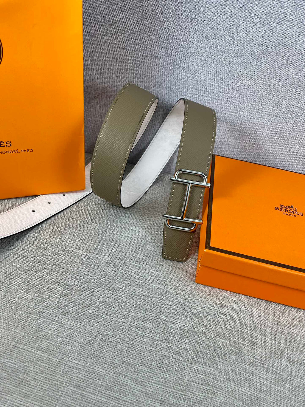 Hermes belt with olive leather straps, gold buckle and visible white inner side