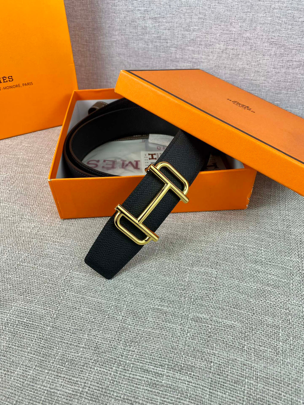 Hermes belt with dark textured leather and gold-tone double-prong buckle