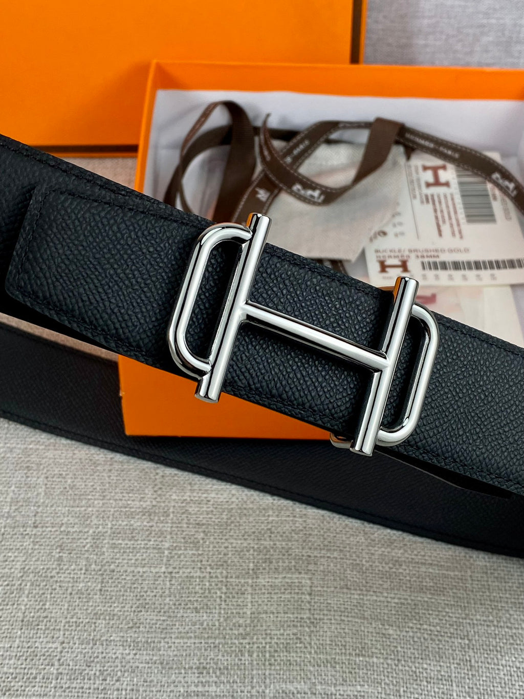 Hermes belt in dark textured leather with silver rectangular double-prong buckle