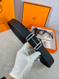 Hermes belt with dark textured leather and silver double-prong buckle, adjustable holes