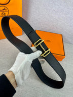 Hermes belt with gold-tone buckle and dark textured leather strap