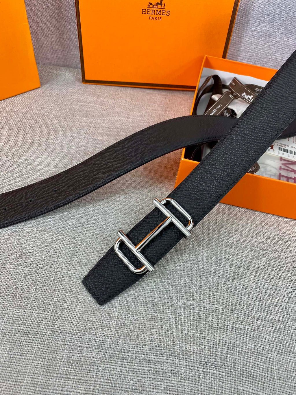 Hermes belt with dark textured leather strap and silver double-prong buckle
