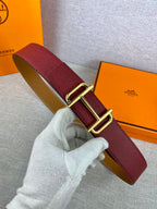 Burgundy leather belt with gold-tone double buckle and adjustable holes