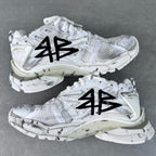 Unisex white sneakers with black graffiti-style print, lace-up, thick midsole