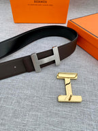 Hermes belt with dark leather strap and gold-tone H buckle