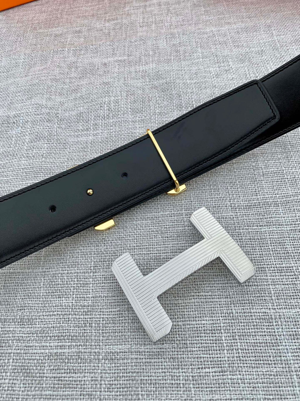 Hermes belt dark leather with gold-tone prong and silver-tone H buckle