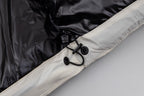 Jacket hem with black drawstring cord and contrasting cream trim panel.