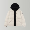 Long puffer jacket with hood, cream body and black front placket and hood lining.