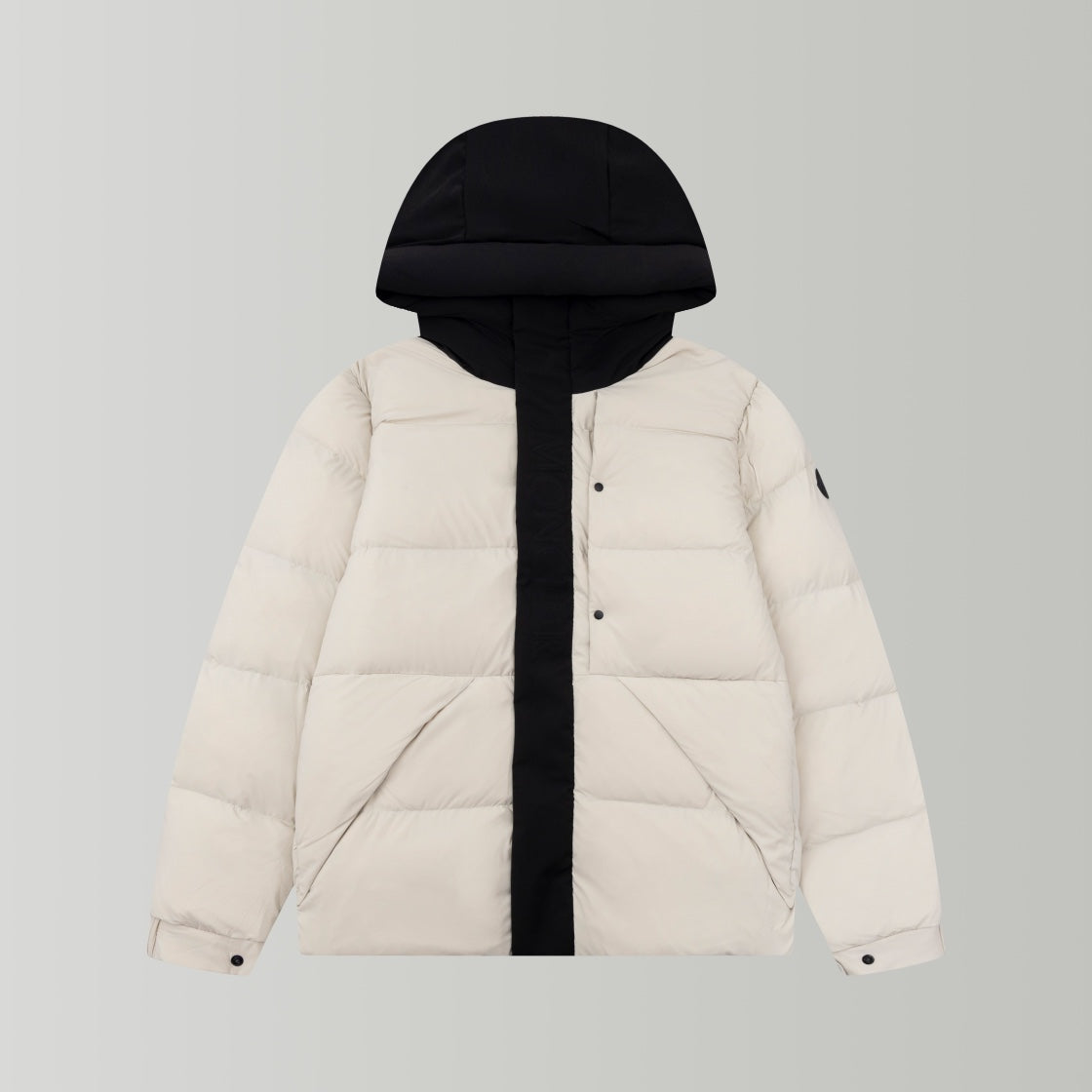 Long puffer jacket with hood, cream body and black front placket and hood lining.