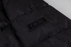 Black long puffer jacket interior patch with Dior logo.