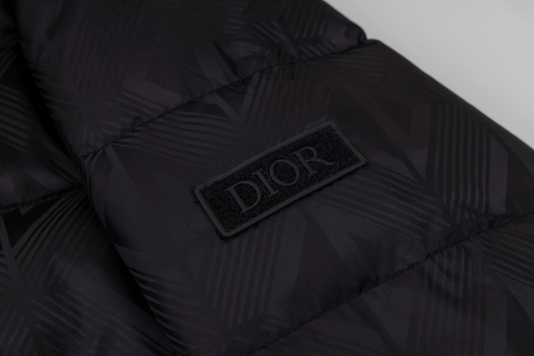 Black long puffer jacket interior patch with Dior logo.