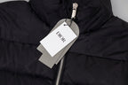 Black long puffer jacket detail with Dior hang tag and metal zipper pull.