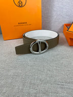 Olive leather belt with silver double-ring buckle and white underside