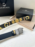 Versace belt detail: baroque gold-and-blue strap with dark buckle and gold trim.