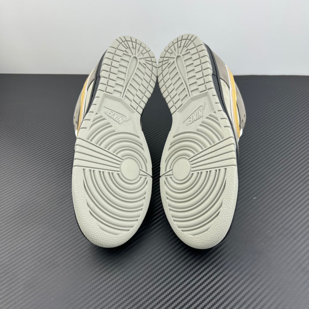Grey sneaker outsole view with deep traction tread and circular grooves