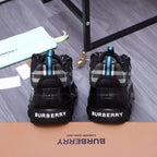 Burberry chunky sneakers, back view with BURBERRY lettering and teal lace accents