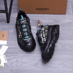 Burberry chunky sneakers, black with teal accents and plaid upper, front and side view