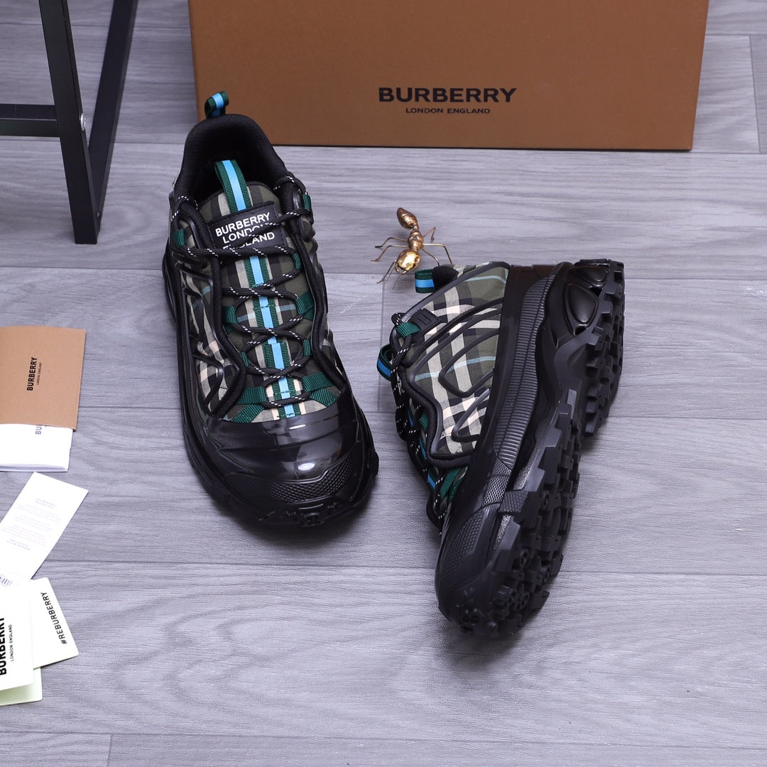 Burberry chunky sneakers, black with teal accents and plaid upper, front and side view