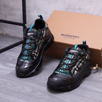 Burberry chunky sneakers, black with teal accents and check laces, pair view