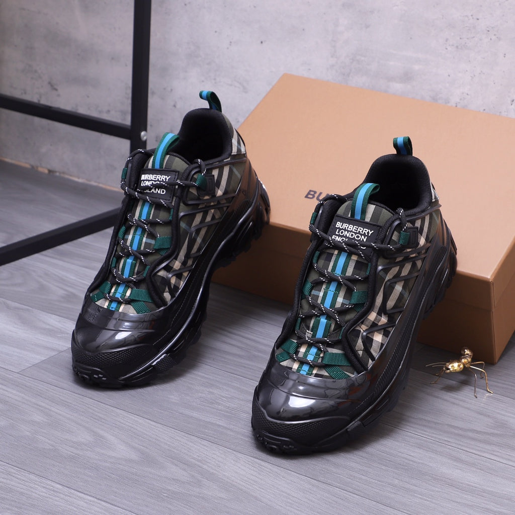 Burberry chunky sneakers, black with teal accents and check laces, pair angle view