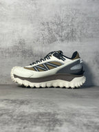 Moncler trail sneaker, side view, white upper with navy stripe and black laces