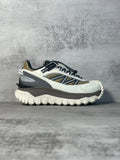 Moncler trail sneaker in white, navy and black with rugged tread outsole