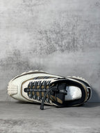 Moncler trail sneaker, close side view, white upper with black laces and trim