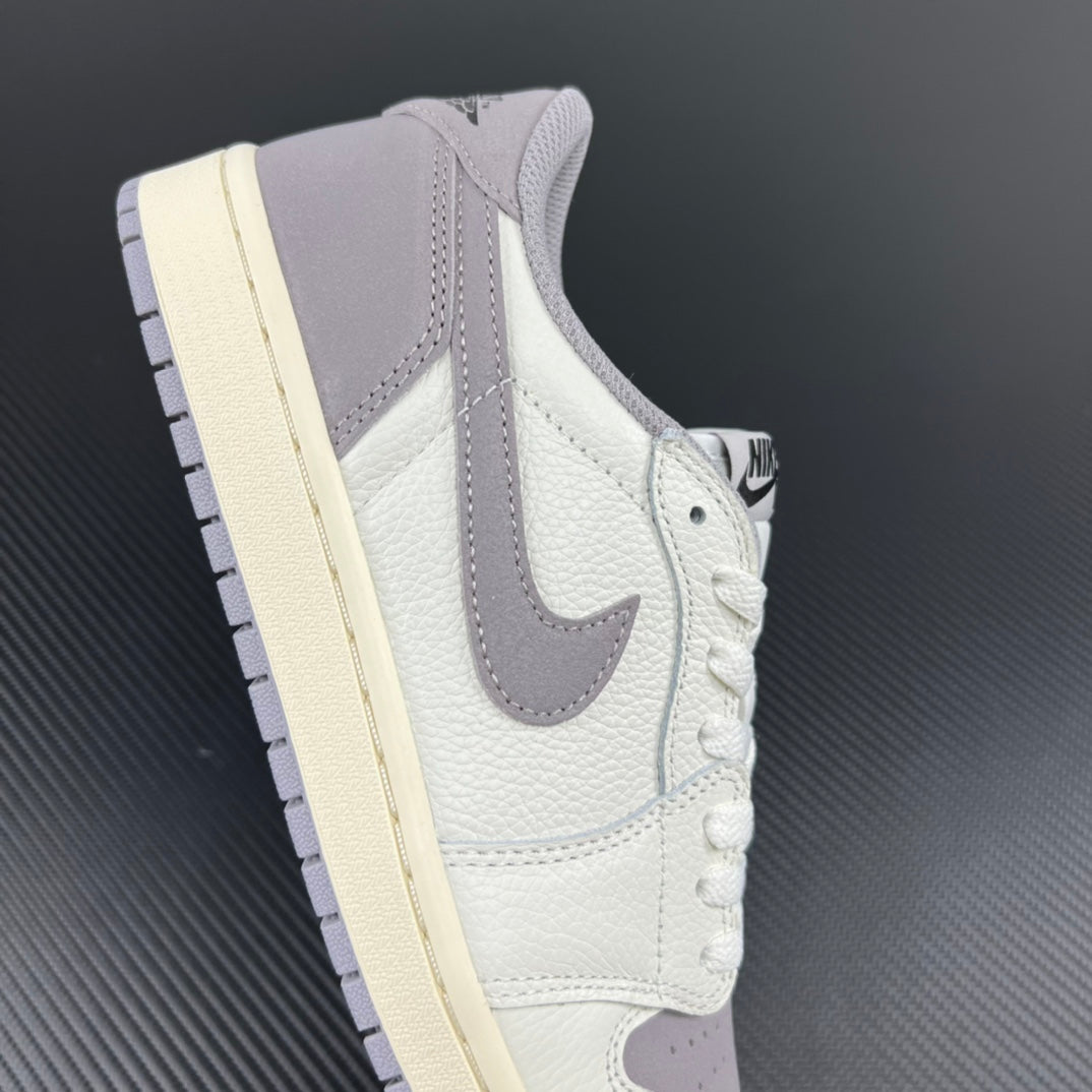 Low-top sneakers with white leather upper, gray swoosh, and lace-up front.