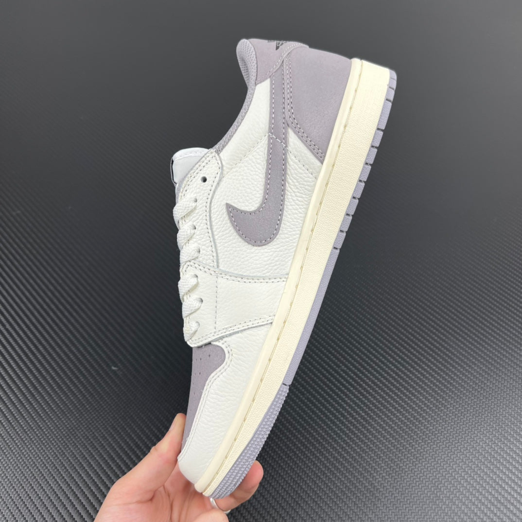 Lace-up low-top sneakers with white upper, gray heel panel, and cream midsole.