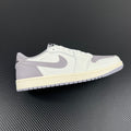 Low-top sneakers in white with light gray suede overlays and cream midsole.