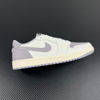 Low-top sneakers in white with light gray suede overlays and cream midsole.