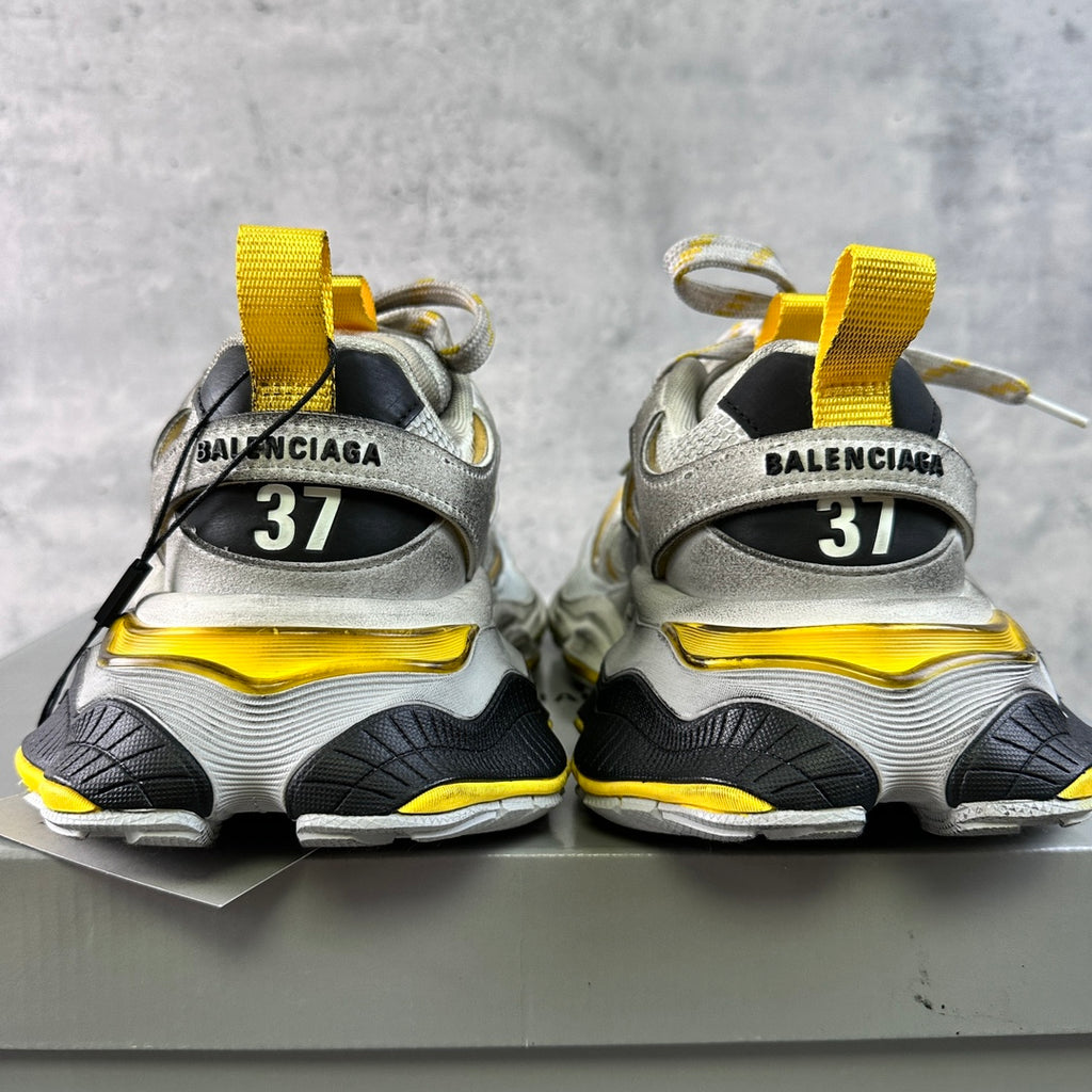Balenciaga unisex sneakers rear view with BALENCIAGA heel tabs and yellow lace accents
