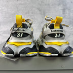 Balenciaga unisex sneakers rear view with BALENCIAGA heel tabs and yellow lace accents