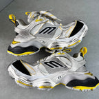 Balenciaga unisex chunky sneakers, silver-gray design with black sides and yellow highlights