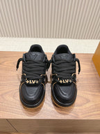 Black trainer sneakers with laces, LV heel logos, tan lug soles