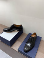 Unisex Dior patent leather lace-up shoes with glossy texture and lace panels