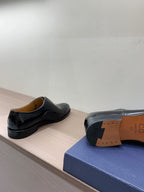 Unisex Dior patent leather lace-up shoes, back view with low-profile sole