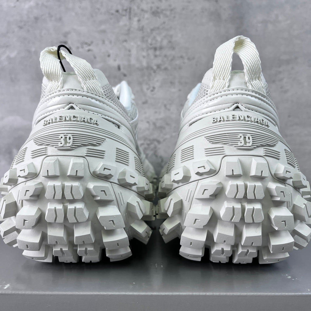 Balenciaga unisex white sneaker soles view with BALENCIAGA text on heel