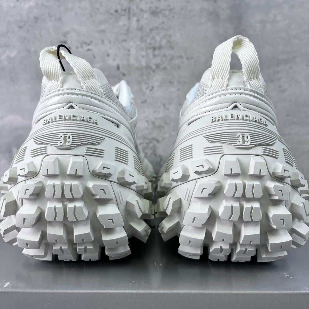 Balenciaga unisex white sneaker soles view with BALENCIAGA text on heel