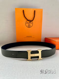 Green leather belt with gold-tone H buckle and keeper loop