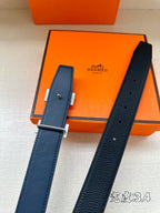 Hermes belt with dark blue leather strap, prong, and gold-tone H buckle