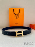 Hermes belt in dark blue leather with gold-tone H buckle and prong