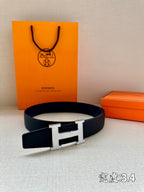 Hermes belt, dark blue leather, gold-tone H buckle on a smooth strap