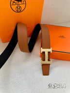 Brown leather belt with silver H buckle, long strap ends