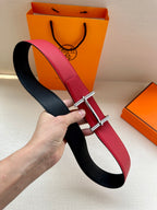 Reversible belt with red and black leather straps and silver-toned buckle.