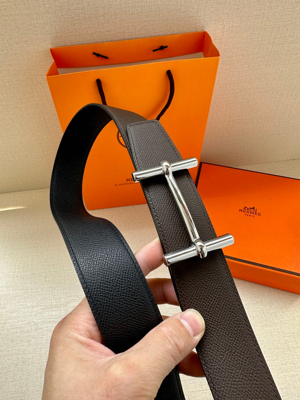 Hermes belt dark textured leather, silver buckle with two long bars.